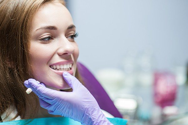 Dentist checking woman's smile