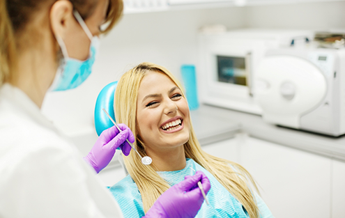 Woman grinning in dental chair