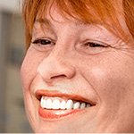Smiling senior woman after tooth replacement with dental implants