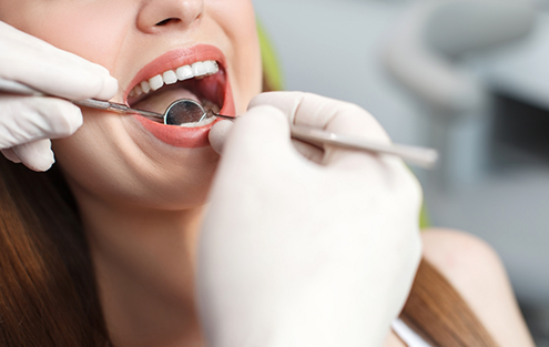 Woman receiving a dental exam