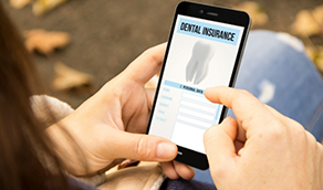 Person looking at dental insurance information on their phone