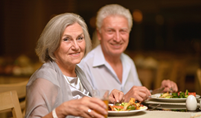 Senior couple sitting at dinner table