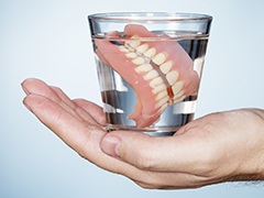 Denture in glass of water