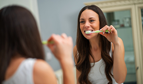 Woman brushing her teeth