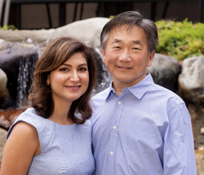 Dr. Hamzehpour and Dr. Cho smiling