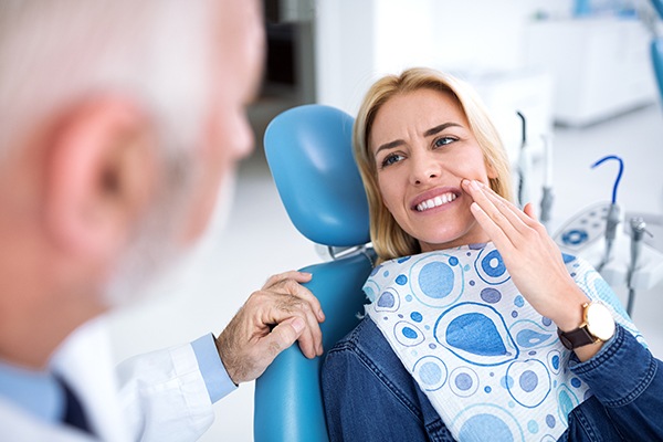 Dentist speaks with patient