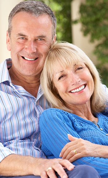 Smiling older man and woman outdoors