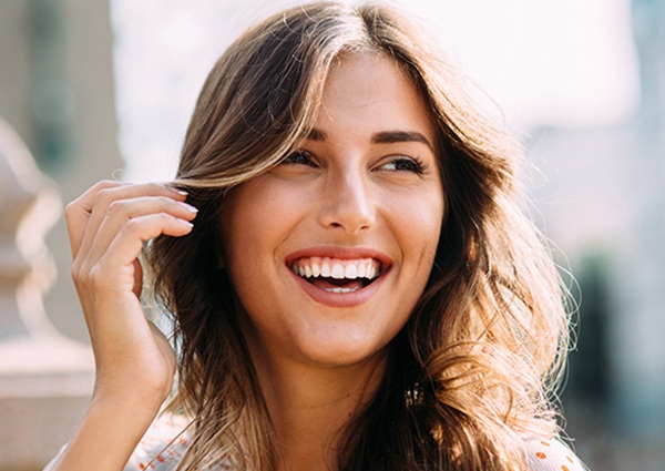 Woman smiling outdoors