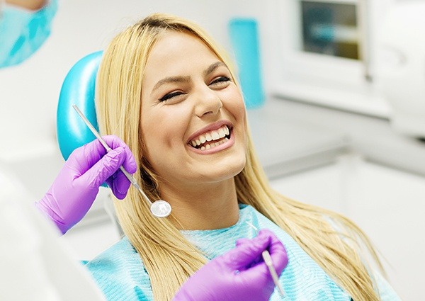 smiling woman in a dental chair