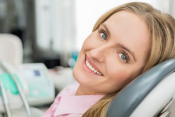 Woman in dental chair smiling