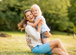 Family smiling outdoors