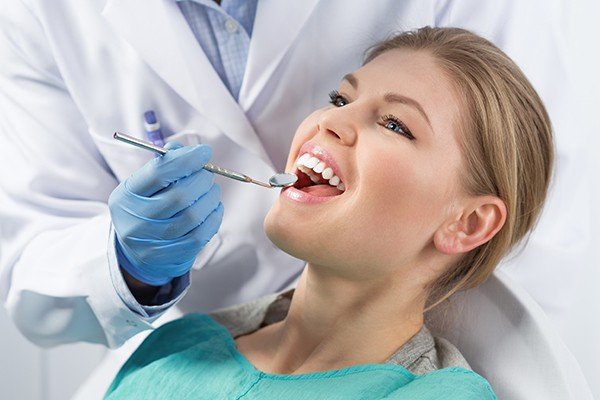 Woman having dental cleaning