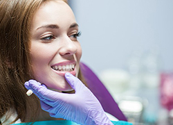 Dentist examining patient's smile