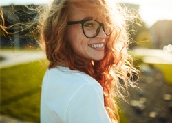 Woman in dental chair smiling