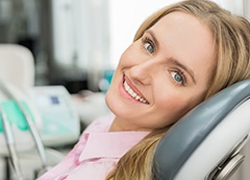 Woman in dental chair smiling