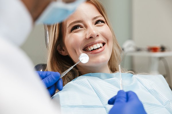 smiling woman in dental chair