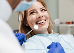 Woman smiling at her dentist