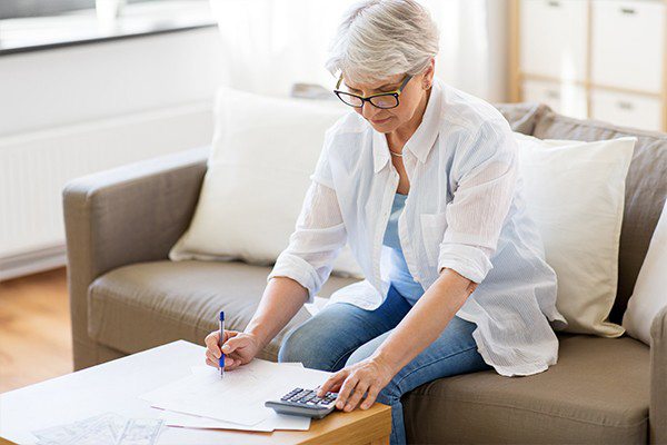 Older woman completing paperwork