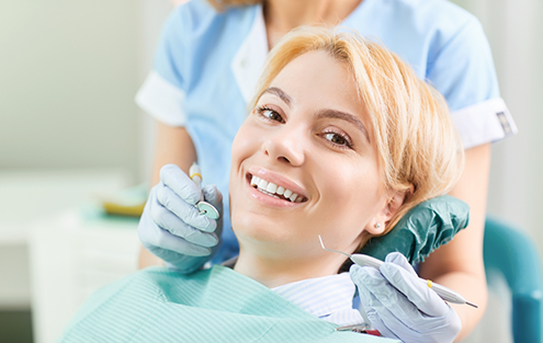 Smiling woman sitting in dental chair
