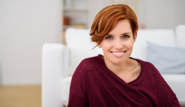 Woman with short red hair smiling