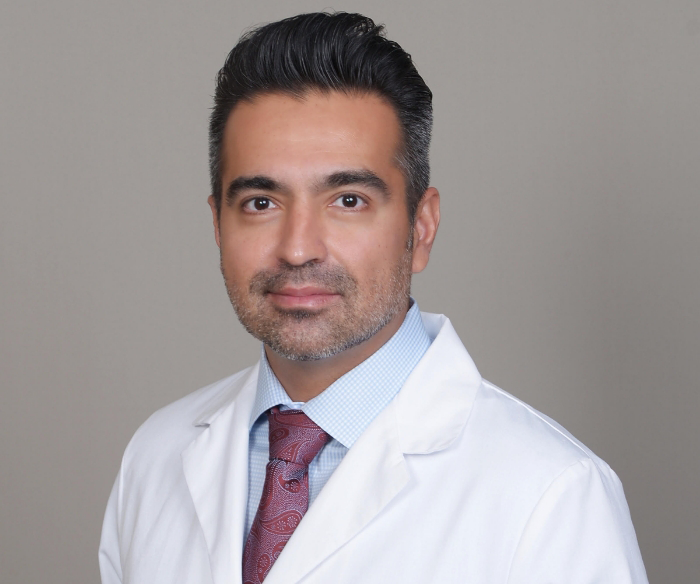 Dr. HAMZEHPOUr, Dr. Cho and Dr. Galvan smiling