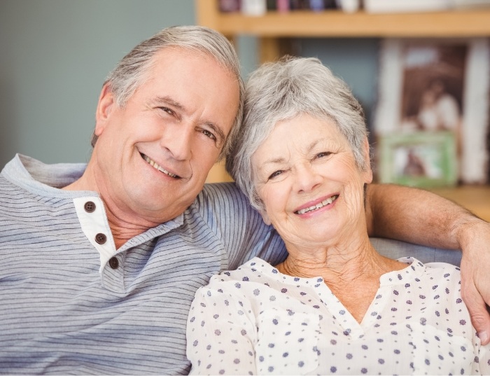 man and woman smiling together