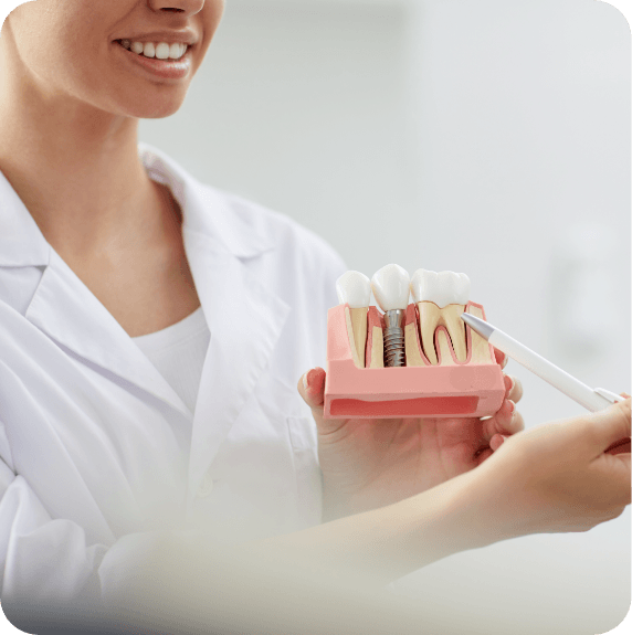 team member working with patient in dental chair