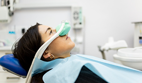 Woman with nitrous oxide mask over her nose
