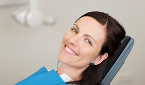 Woman grinning in dental chair