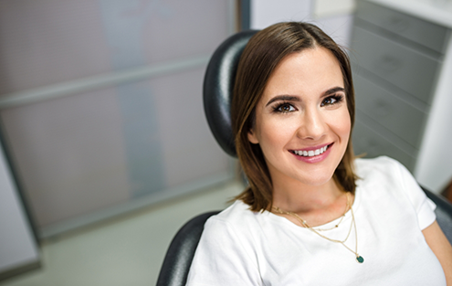 Young woman smiling in dental chair