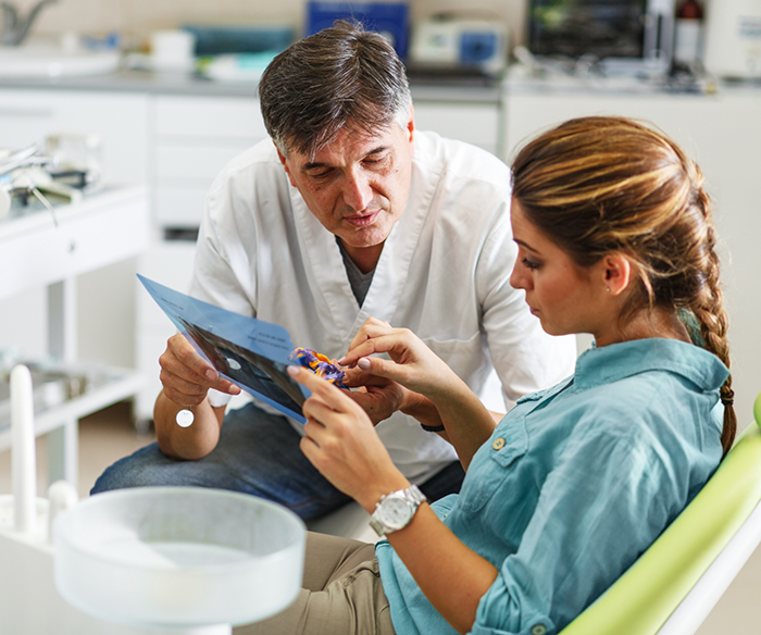 Dentist talking to a patient about wisdom tooth extractions in Torrance
