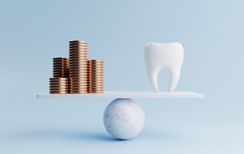 Illustrated scale with a pile of coins and a model of a tooth