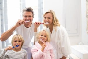 family brushing teeth