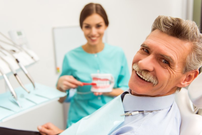 Man smiling at dental implant appointment