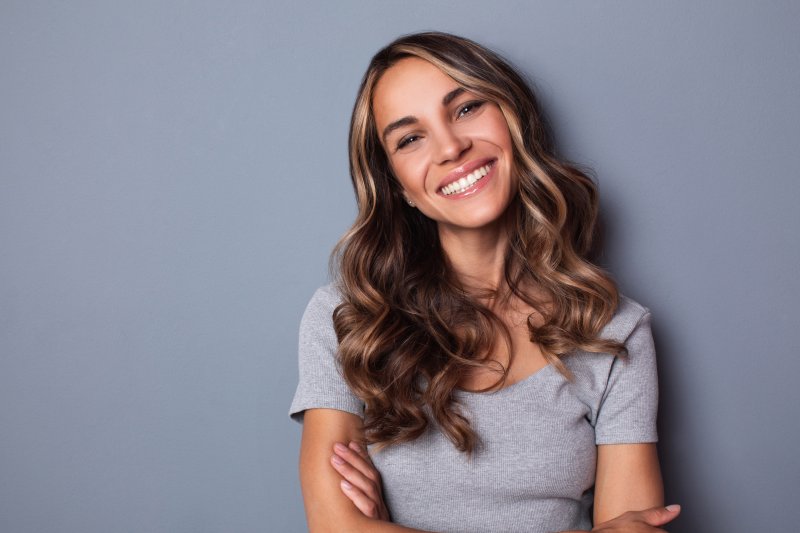 Woman smiling with porcelain veneers