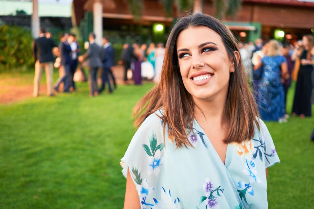 Woman with white teeth smiling at wedding