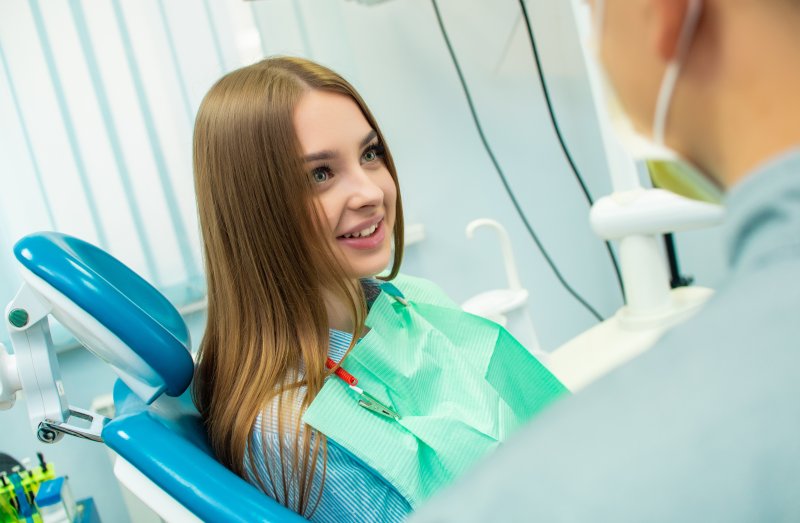 Dentist talking to patient about their smile makeover