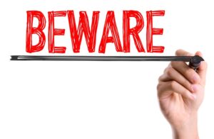 “Beware” written in red lettering underlined in black